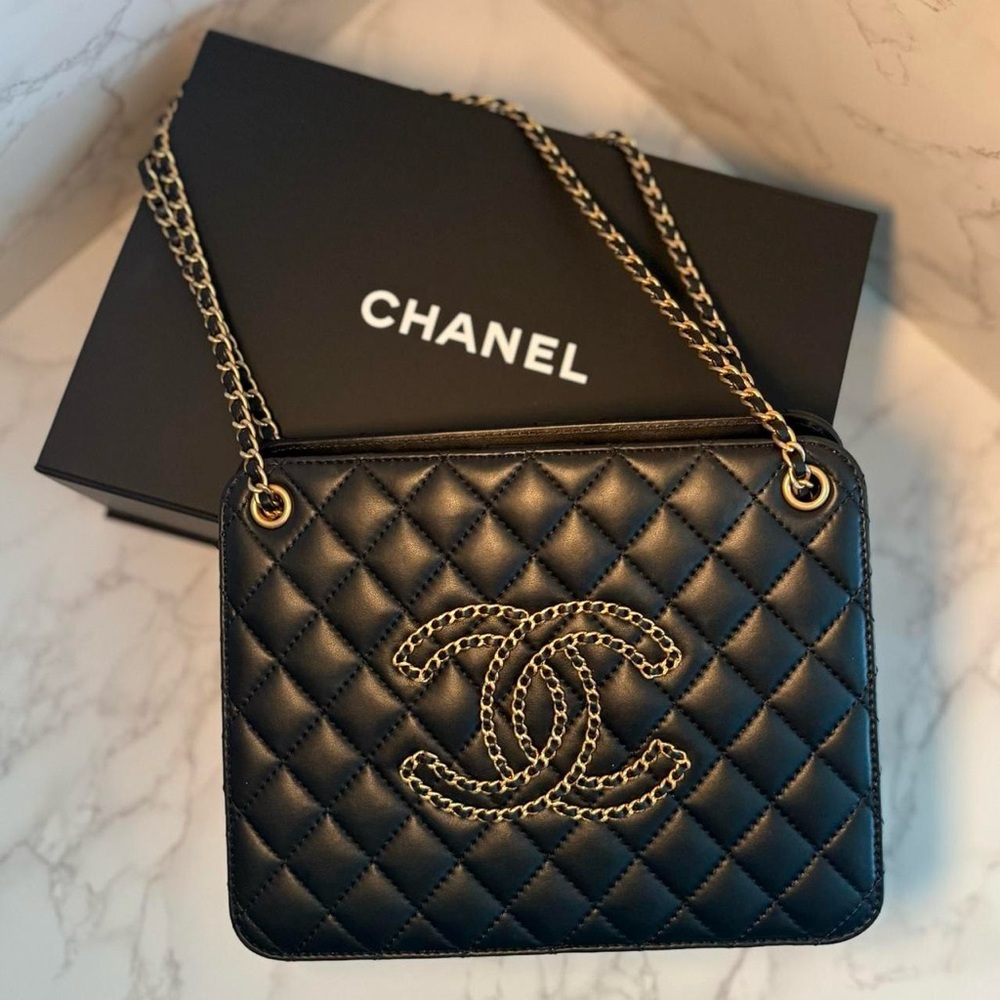 Authentic CHANEL Black Lambskin Accordion Bag with original box and dust bag.
